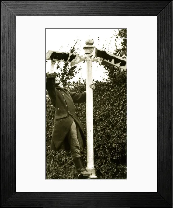 Framed Print : Retreating Belgian soldier obliterating signpost names Framed Print : Retreating Belgian soldier obliterating signpost names