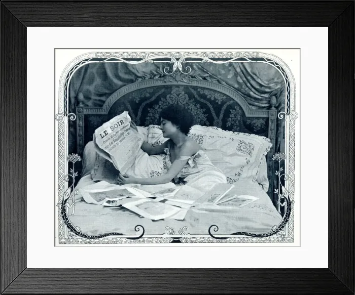 Framed Print : Lady reading the newspaper in bed Framed Print : Lady reading the newspaper in bed