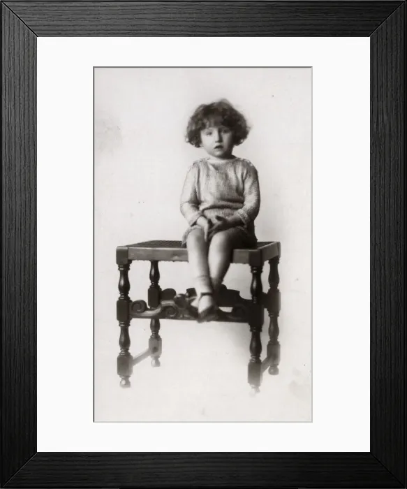 Framed Print : A Little girl photographed on a turned wooden stool Framed Print : A Little girl photographed on a turned wooden stool