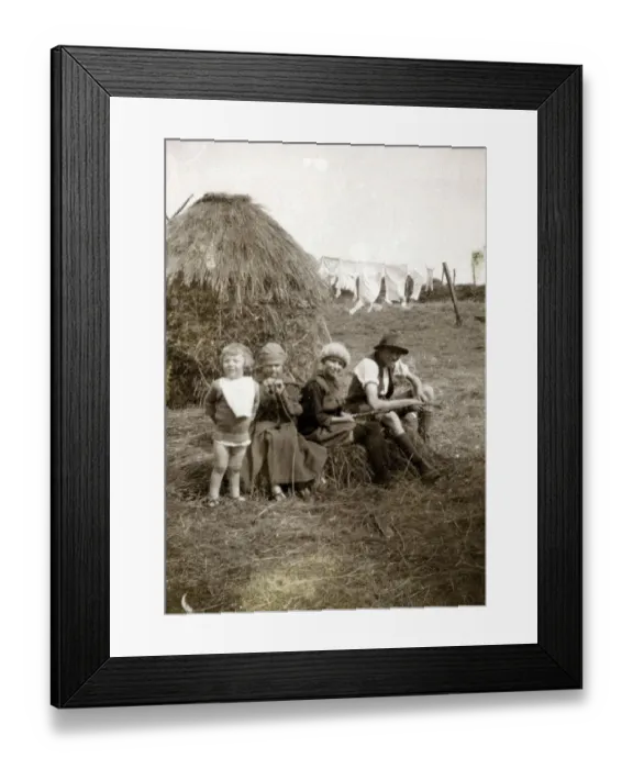 Framed Print : Four children sitting in a farmers field near a hayrick Framed Print : Four children sitting in a farmers field near a hayrick