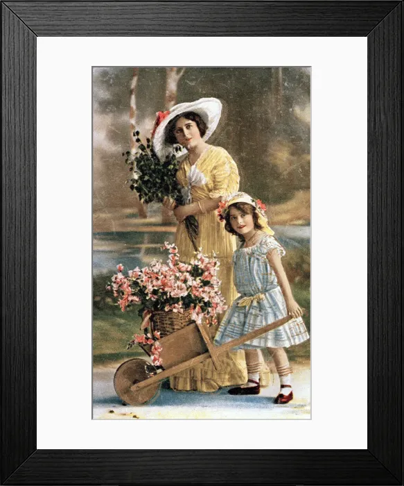 Framed Print : Woman and girl with flowers in a wheelbarrow Framed Print : Woman and girl with flowers in a wheelbarrow