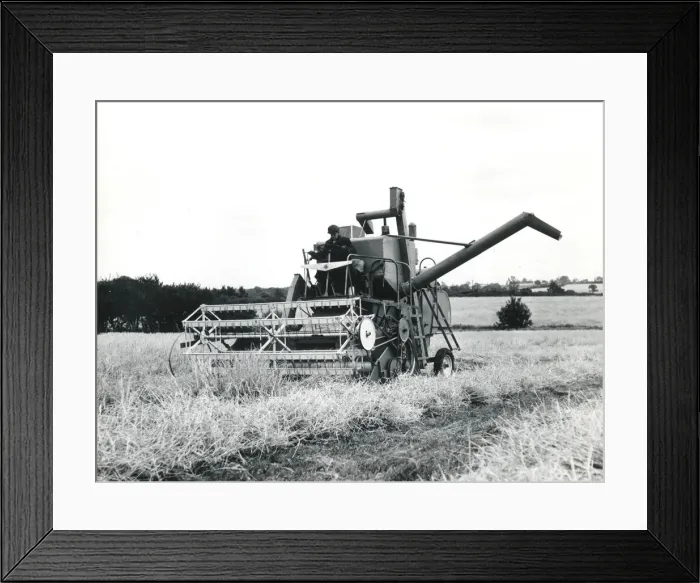 Framed Print : Man operating a combine harvester, Cornwall Framed Print : Man operating a combine harvester, Cornwall