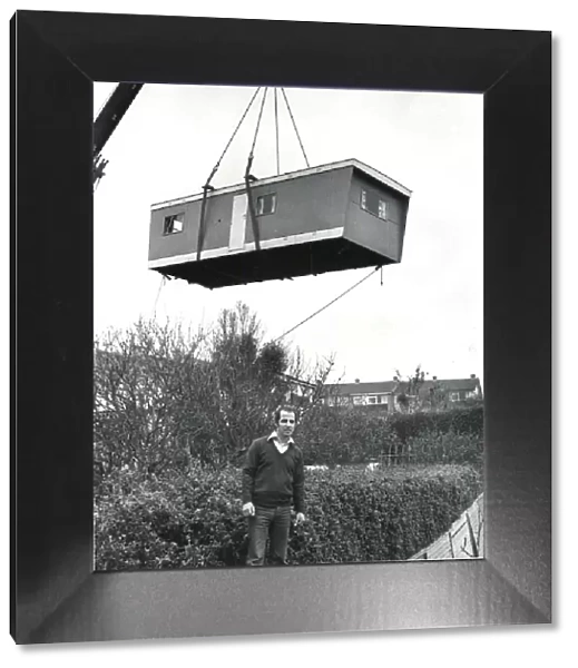 Prefabricated unit delivered to a garden by crane