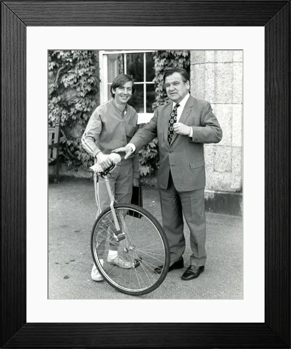 Framed Print : Unicyclist at start of a cycle ride, Lands End, Cornwall Framed Print : Unicyclist at start of a cycle ride, Lands End, Cornwall