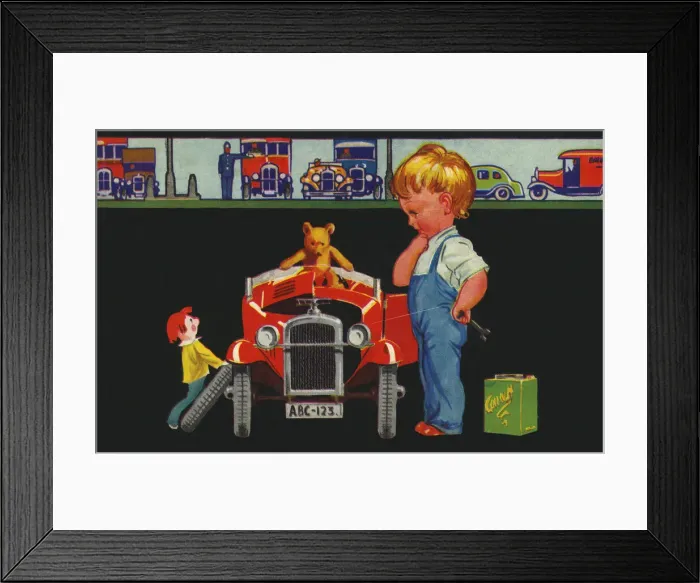 Framed Print : Children. Boy mechanic mending toy car. Date: circa 1925 Framed Print : Children. Boy mechanic mending toy car. Date: circa 1925