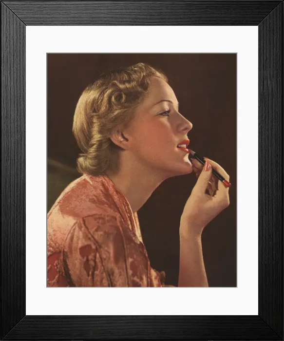 Framed Print : Woman applying lipstick Framed Print : Woman applying lipstick