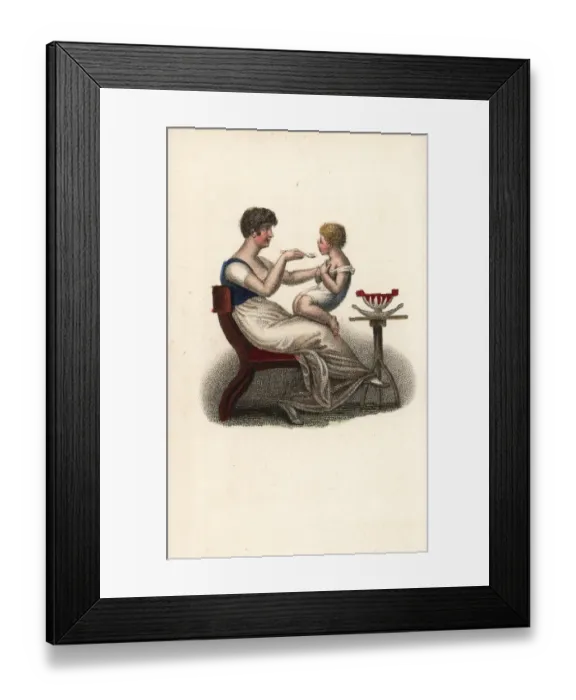 Framed Print : Mother feeding her child on her lap Framed Print : Mother feeding her child on her lap