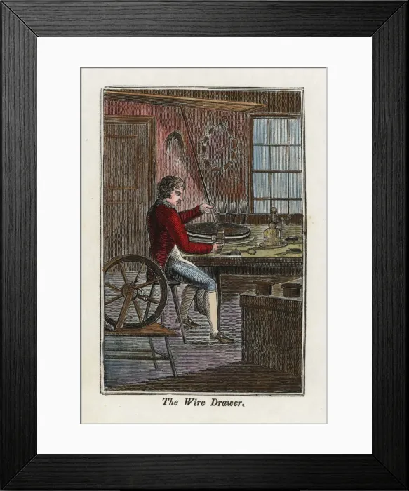 Framed Print : A metal worker using a wire-drawing machine Framed Print : A metal worker using a wire-drawing machine