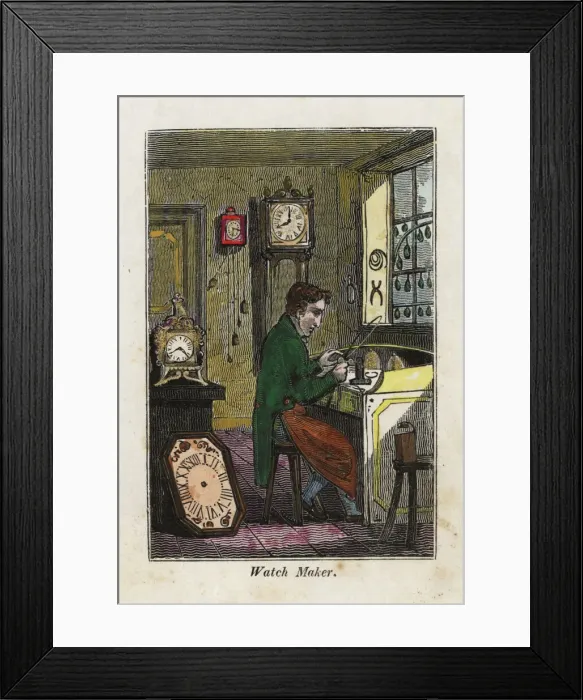Framed Print : Watch maker in apron seated at his bench making metal gears Framed Print : Watch maker in apron seated at his bench making metal gears