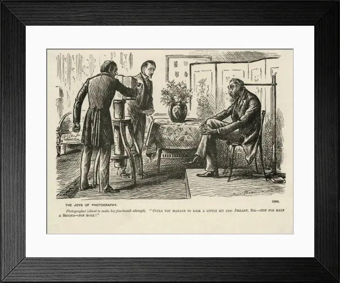 Framed Print : Photographer tries to get sitter to appear pleasant Framed Print : Photographer tries to get sitter to appear pleasant