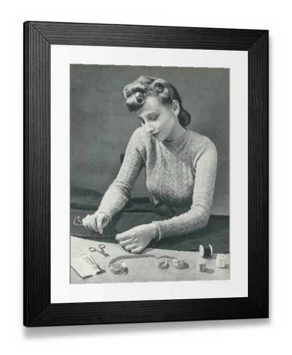 Framed Print : Woman tacking a hem before stitching it Framed Print : Woman tacking a hem before stitching it