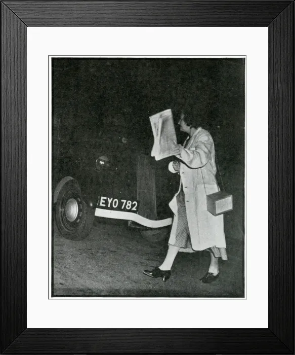 Framed Print : Woman crossing road in the dark in white coat, Sept 1939 Framed Print : Woman crossing road in the dark in white coat, Sept 1939