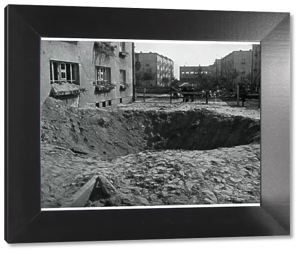 Bomb crater in Warsaw street, September 1939