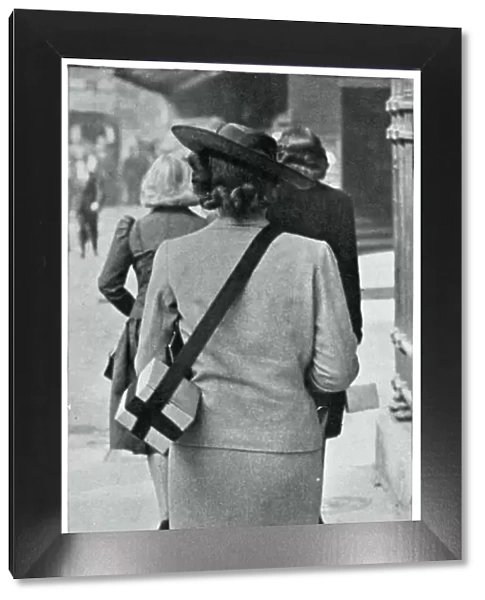 Woman carrying gas mask correctly, September 1939