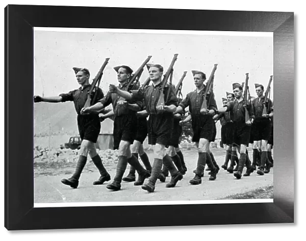 Soldiers marching in shorts in Wales, September 1939
