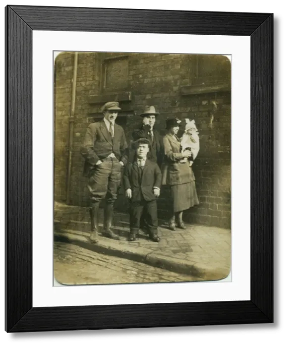 Framed Print : Group of people, possibly family members, including a man of restricted growth (dwarfism) Framed Print : Group of people, possibly family members, including a man of restricted growth (dwarfism)