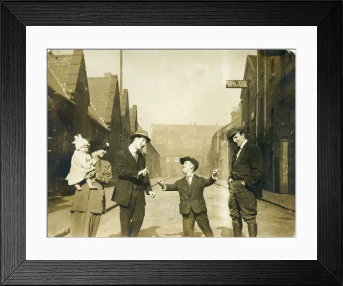 Framed Print : Group of people, possibly family members, including a man of restricted growth (dwarfism) Framed Print : Group of people, possibly family members, including a man of restricted growth (dwarfism)