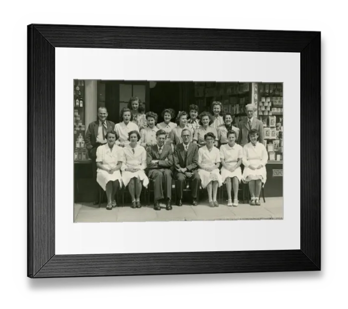 Framed Print : Group photo, staff outside a grocery shop Framed Print : Group photo, staff outside a grocery shop