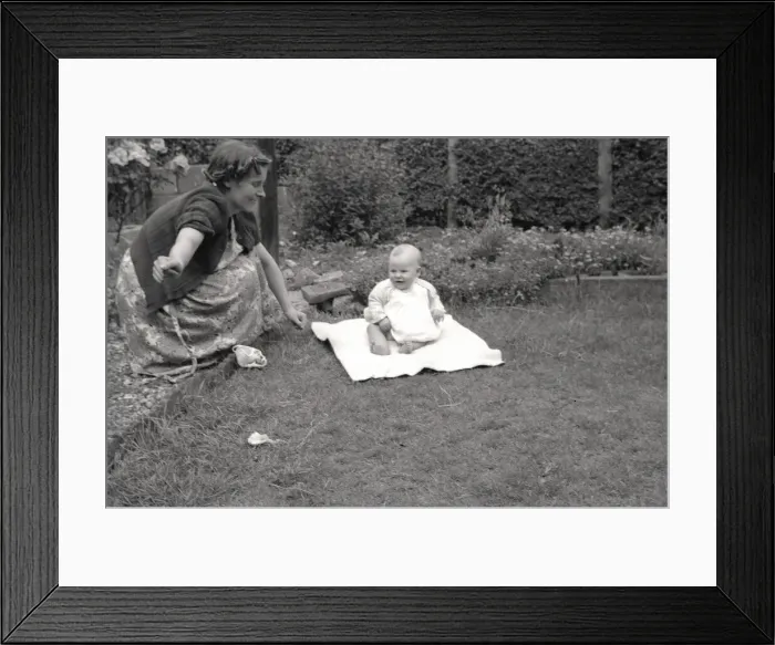 Framed Print : Mother and her young baby playing out in the garden Framed Print : Mother and her young baby playing out in the garden