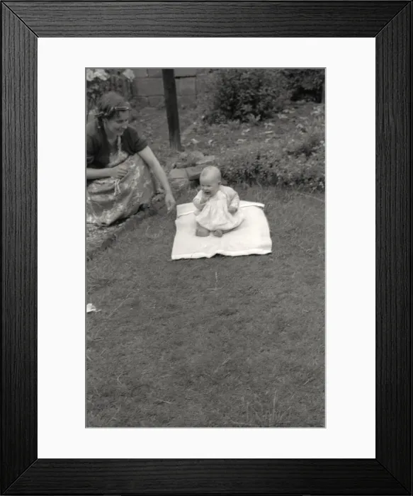 Framed Print : Mother and her young baby playing in the garden Framed Print : Mother and her young baby playing in the garden
