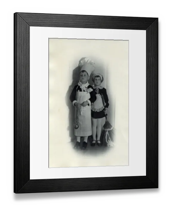 Framed Print : Two children in fancy dress; the little boy is dressed as a chef while a little girl Framed Print : Two children in fancy dress; the little boy is dressed as a chef while a little girl