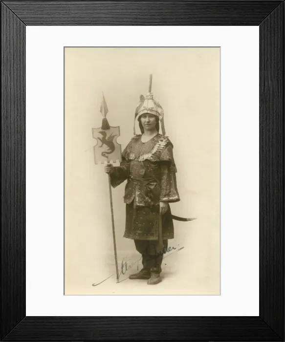 Framed Print : A woman in an interesting militaristic exotic costume, holding a standard. Date: c Framed Print : A woman in an interesting militaristic exotic costume, holding a standard. Date: c
