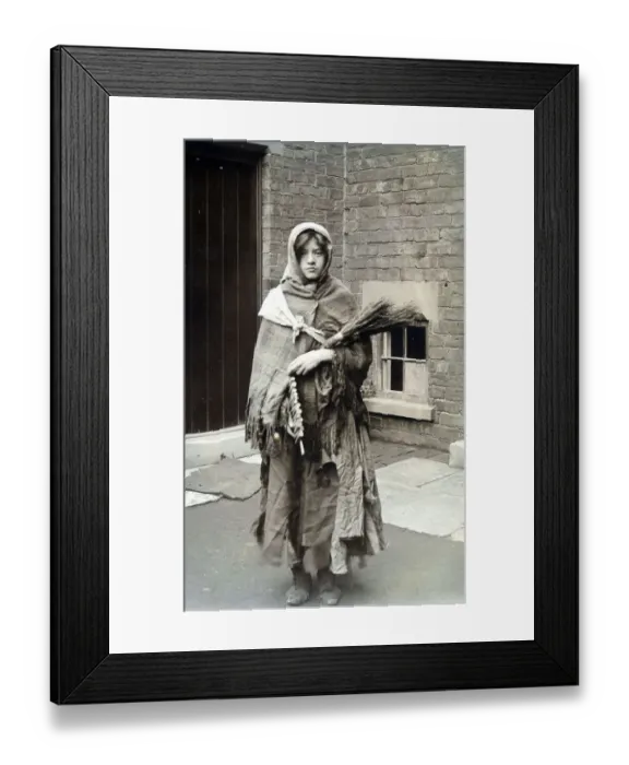 Framed Print : Woman dressed as winter, swaddled in rag and carrying fire wood. Date: c. 1915 Framed Print : Woman dressed as winter, swaddled in rag and carrying fire wood. Date: c. 1915