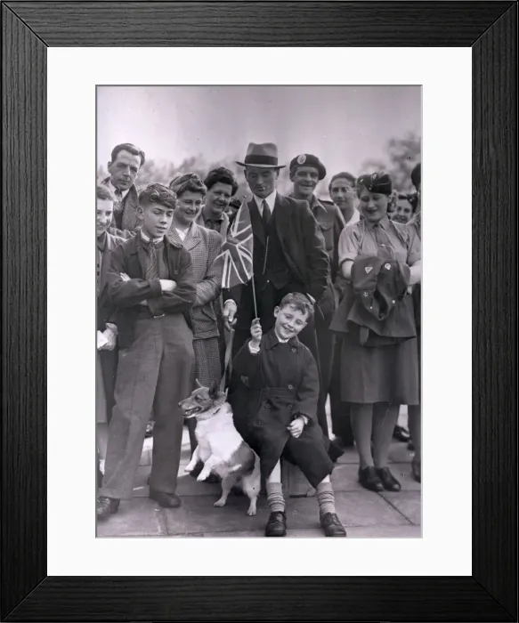 Framed Print : VE Day. A group of people celebrating VE Day including an excitable terrier Framed Print : VE Day. A group of people celebrating VE Day including an excitable terrier