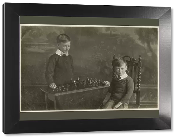 Two smart young boys play with their model tin soldiers