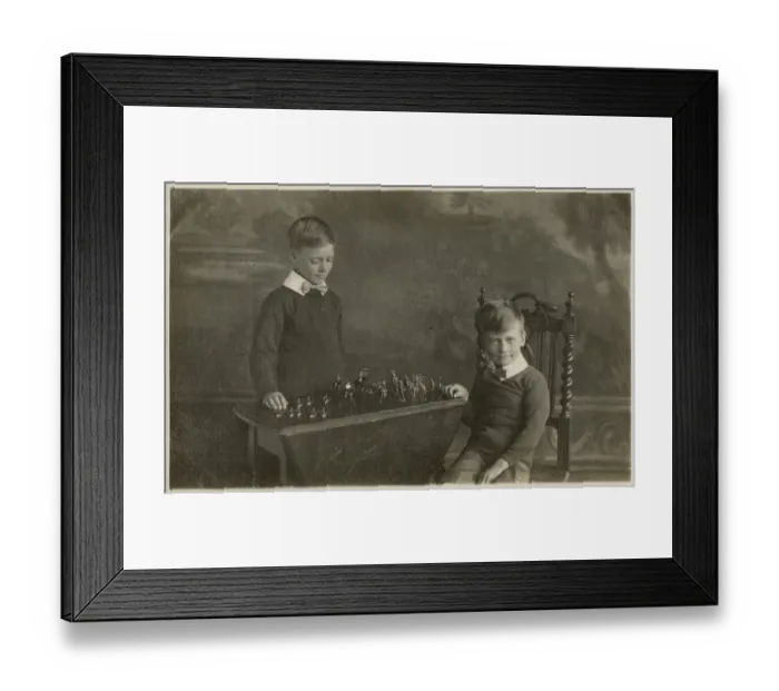 Framed Print : Two smart young boys play with their model tin soldiers