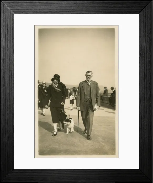 Framed Print : Taking dog for a walk along the seafront at Scarborough Framed Print : Taking dog for a walk along the seafront at Scarborough