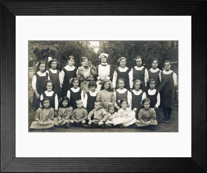Framed Print : Group of schoolchildren with teacher, nurse and cat Framed Print : Group of schoolchildren with teacher, nurse and cat