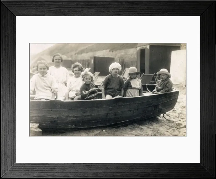 Framed Print : Children playing in rowing boat on beach at Gorleston-on-Sea Framed Print : Children playing in rowing boat on beach at Gorleston-on-Sea