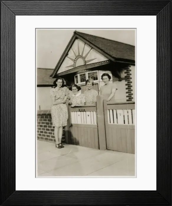 Framed Print : Mother and daughters by the gate of a lovely bungalow Framed Print : Mother and daughters by the gate of a lovely bungalow