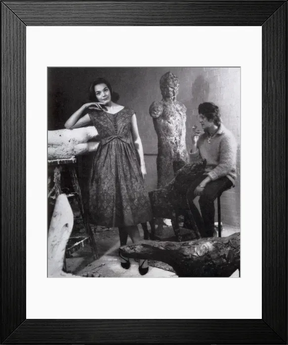 Framed Print : Model wearing a cotton dress by Sambo, visits Elisabeth Frink, the sculptor in her studio Framed Print : Model wearing a cotton dress by Sambo, visits Elisabeth Frink, the sculptor in her studio
