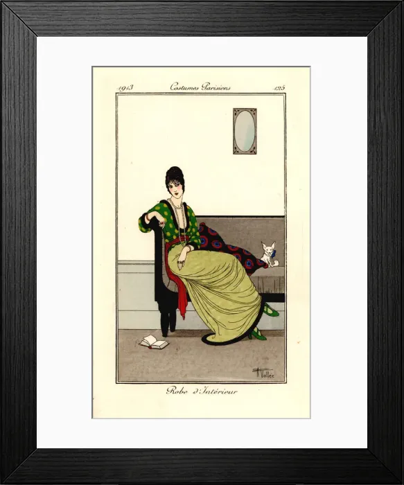 Framed Print : Woman in fashionable outfit seated on a sofa with