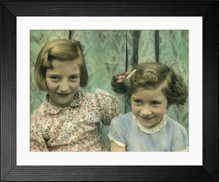 Framed Print : Delightful colour photograph of two little girls, possibly sisters, seated together Framed Print : Delightful colour photograph of two little girls, possibly sisters, seated together