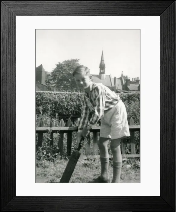 Framed Print : A Young boy playing cricket in a suburban garden - he awaits for a delivery to arrive Framed Print : A Young boy playing cricket in a suburban garden - he awaits for a delivery to arrive