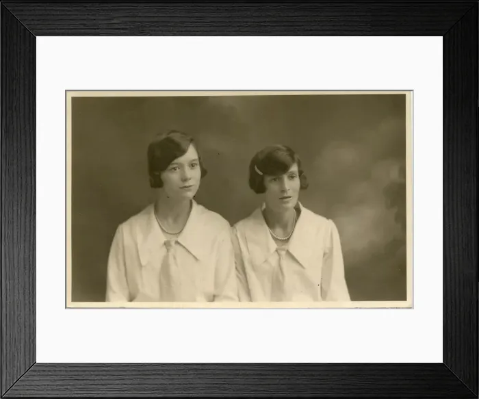 Framed Print : Studio portrait of two women, both with their dark hair bobbed Framed Print : Studio portrait of two women, both with their dark hair bobbed