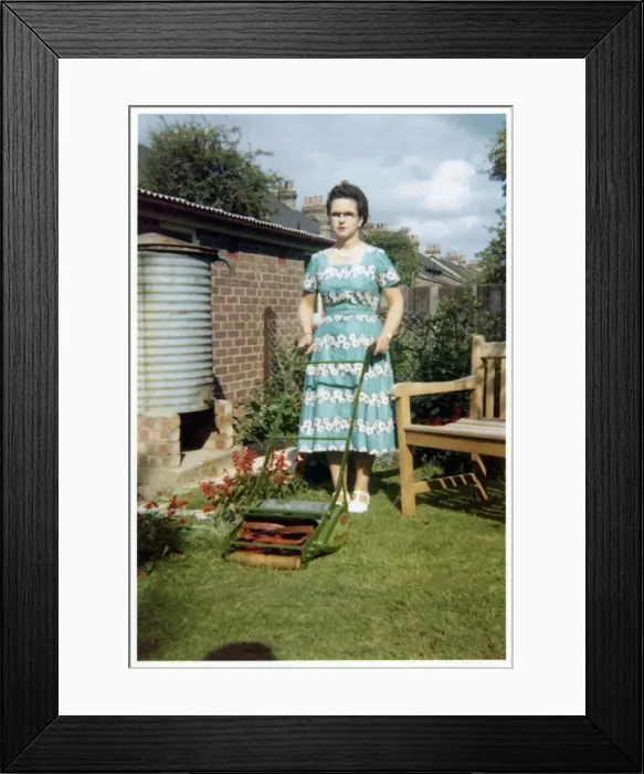 Framed Print : Surburban garden scene - lady and lawnmower Framed Print : Surburban garden scene - lady and lawnmower