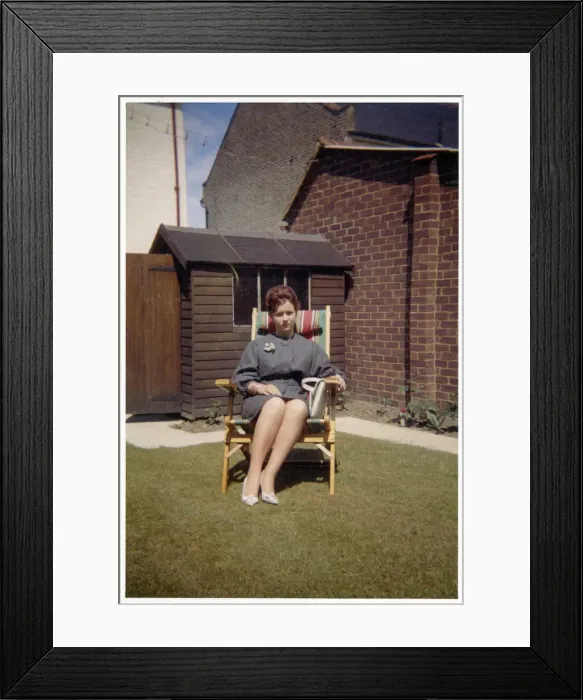 Framed Print : Smart young lady - suburban garden - comfy garden chair Framed Print : Smart young lady - suburban garden - comfy garden chair