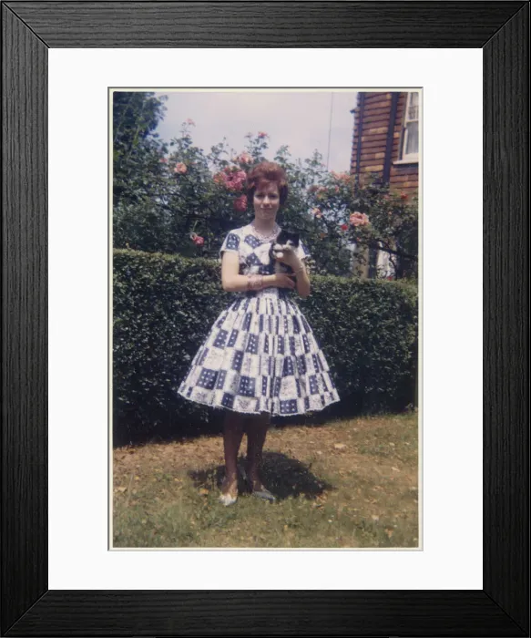 Framed Print : Young lady in smart summer frock - suburban garden Framed Print : Young lady in smart summer frock - suburban garden