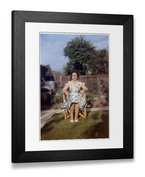 Framed Print : Woman sitting in garden chair - neat suburban garden Framed Print : Woman sitting in garden chair - neat suburban garden
