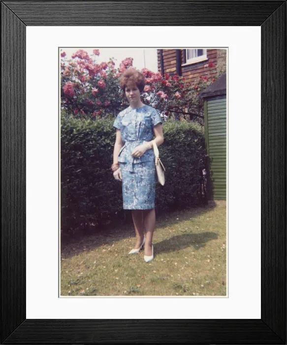 Framed Print : Young lady in a smart two-piece blue and white summer outfit Framed Print : Young lady in a smart two-piece blue and white summer outfit