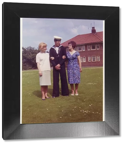 A young naval cadet with his Mother and older sister