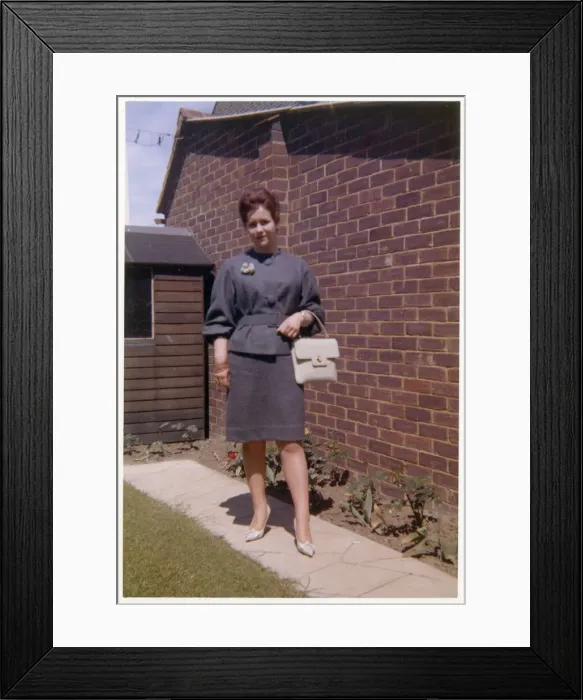 Framed Print : Young woman in a smart two piece dark grey outfit Framed Print : Young woman in a smart two piece dark grey outfit