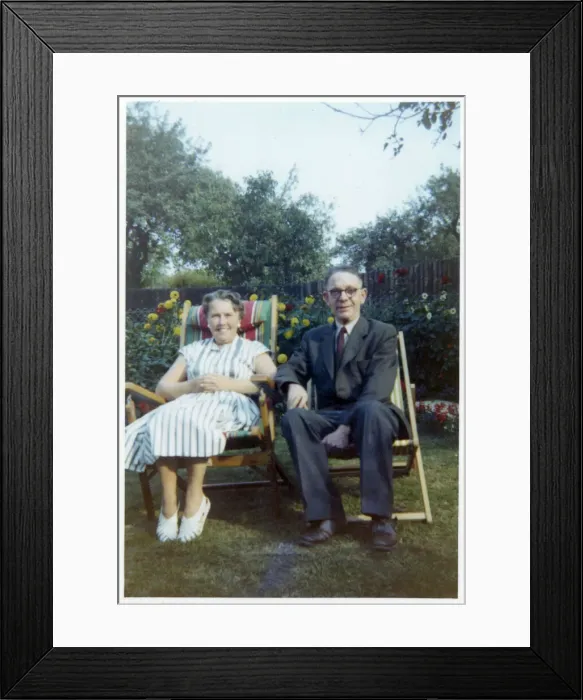 Framed Print : A jolly older couple in a neat suburban back garden Framed Print : A jolly older couple in a neat suburban back garden