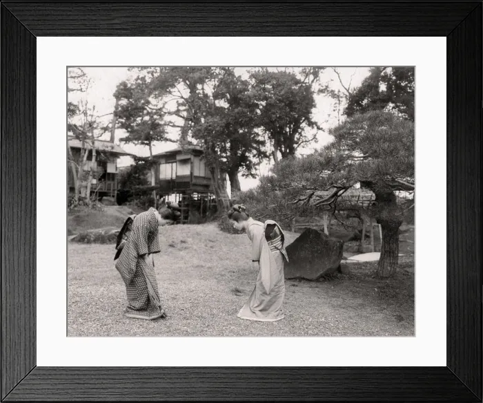 Framed Print : Two young Japanese women bowing to each other, greeting Framed Print : Two young Japanese women bowing to each other, greeting