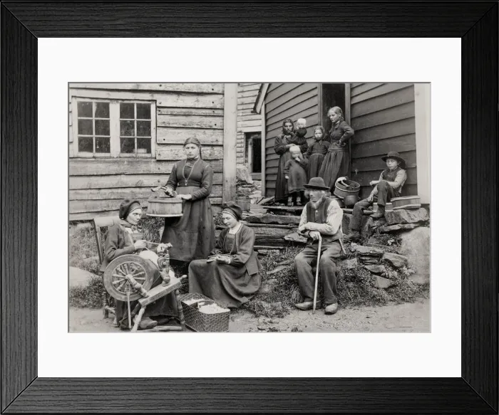 Framed Print : Norway, rural family outside home with spinning wheel