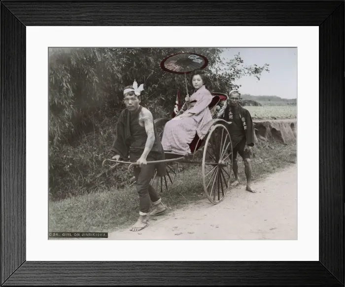 Framed Print : Young woman being pulled in a rickshaw jinrikisha Framed Print : Young woman being pulled in a rickshaw jinrikisha